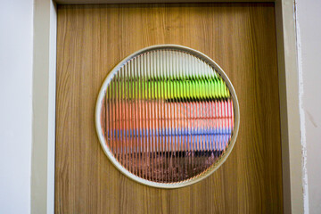 Corrugated glass texture with reflected on wooden door,modern home decor,stylish home...