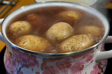 boiled potatoes in a pan	