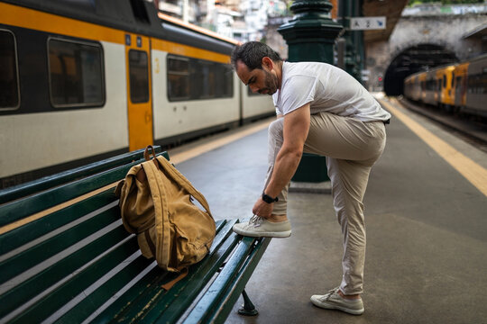 young traveler waiting for the train in a station in europe