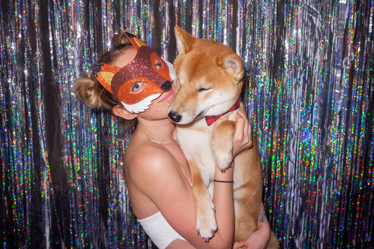 Woman celebrating with her dog 