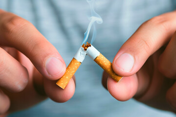 hand breaking a cigar