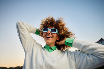 Excited woman with sunglasses
