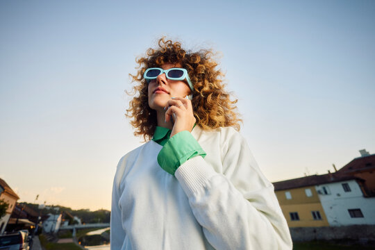 Proud looking woman making a phone call