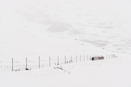 Train passing on the snow mountain in Switzerland
