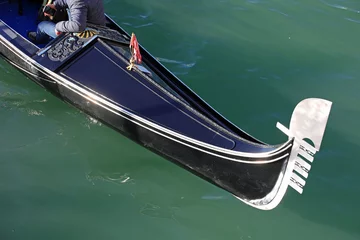 Fototapete Gondeln gondola  the traditional Venetian boat for transporting tourists on the Grand Canal without people on board  © ChiccoDodiFC