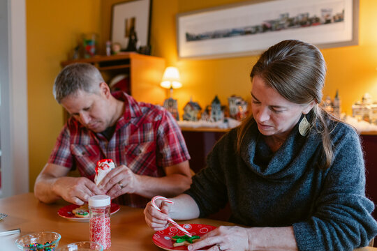 Couple decorating cookies