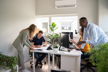 Colleagues Working Together At Office Room