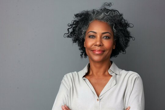 Elegant Mature Black Woman With Curly Grey Hair In A Professional Studio Portrait