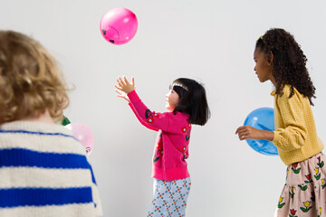 Kids playing with balloon
