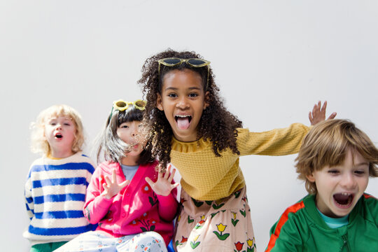 Four cute kids  in studio. 