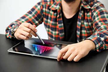 Business man using tablet with holographic graphs and stock market statistics gain profits.  Man working with digital tablet computer. Business strategy. Digital marketing