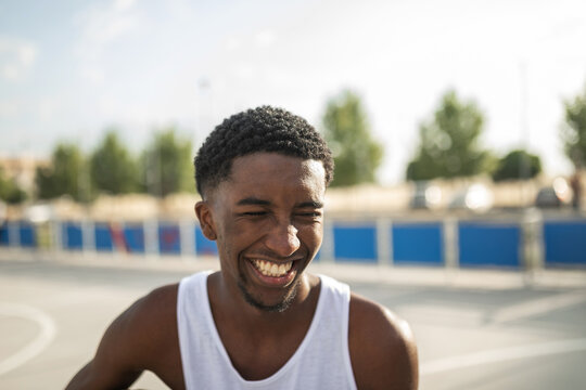 portrait of black teen boy in basketball