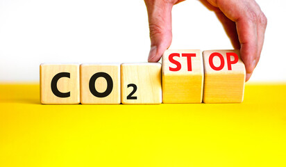 CO2 stop symbol. Concept word CO2 or CO2 stop on a beautiful wooden cubes. Beautiful yellow table...