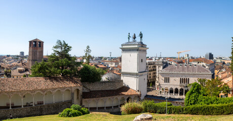 Panoramic iew of the tower of the cathedral and roofs of the city from the top of the garden of the...