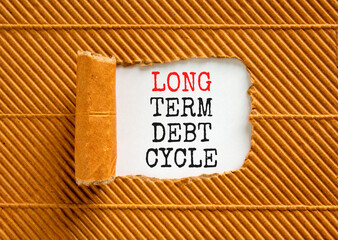 Long term debt cycle symbol. Concept words Long term debt cycle on beautiful white paper. Beautiful brown background. Business Long term debt cycle concept. Copy space.