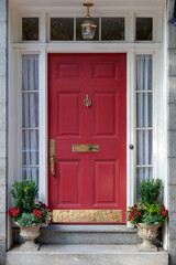 A bold red front door is inviting, vibrant and a beacon of classic elegance.
 - obrazy, fototapety, plakaty