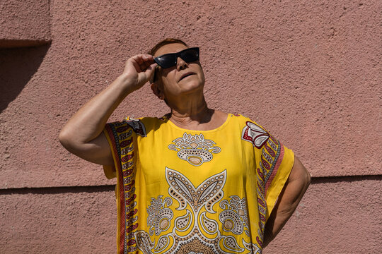 Portrait Of Modern And Bright Elderly Woman.