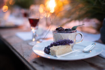 panna cotta dessert with berry compot and shortbread at party