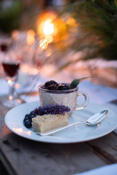 panna cotta dessert with berry compot and shortbread at party