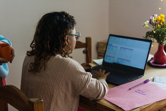 Woman organizing payments, debt