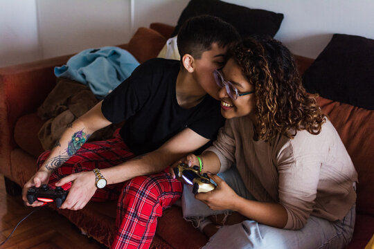 Sweet moment lesbian couple playing video games