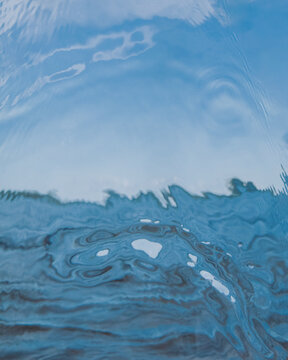 a scenery shot through a glassy impact of water