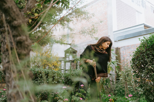 Traditional Gardening in a poncho