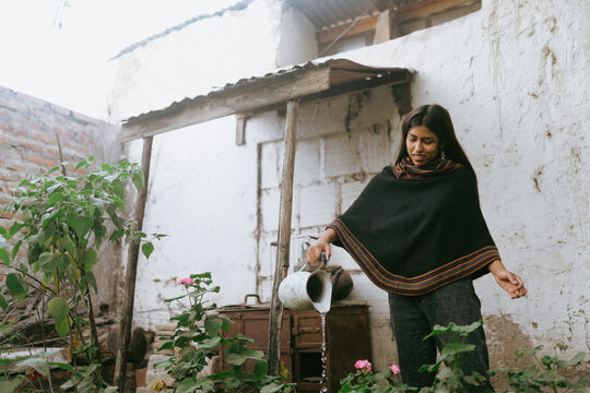 Garden Caretaker watering flowers