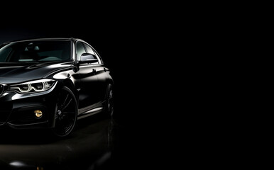 Black generic and unbranded car isolated on a black background, copyspace