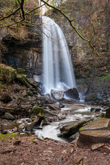 A long exposure of a waterfall in Wales which shows the movement of the water. Melincourt falls, Sgwd Rhyd Yr Hesg, located near the town of Resolven in South wales - 753870325