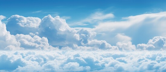 A commercial airplane is seen flying through a sky filled with fluffy blue clouds, creating a dynamic and striking scene. The plane stands out against the vivid blue backdrop as it makes its way