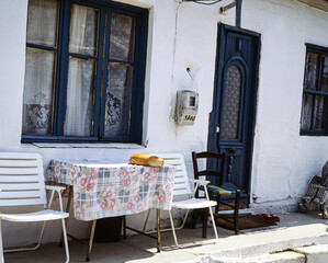 table and chairs with loaf of bread, greece, grekland,EU, europa,medelhavet