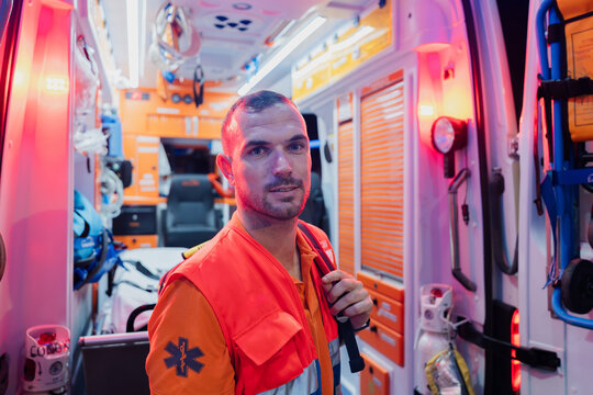 close-up portrait of a paramedic next to an ambulance