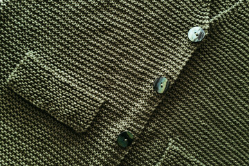 Close-up knitted green jacket. 