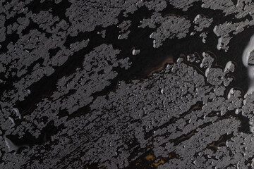 black slate board with water droplets