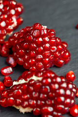 red grains of peeled pomegranate fruit