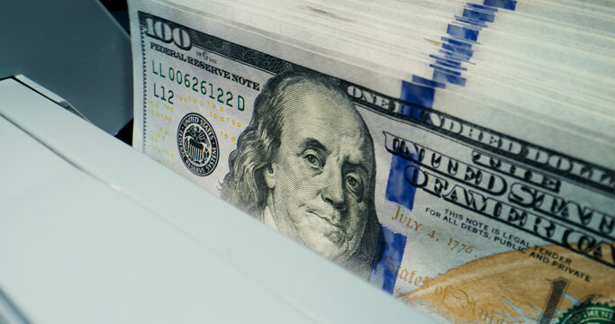 Hundred-dollar bills in the counting machine