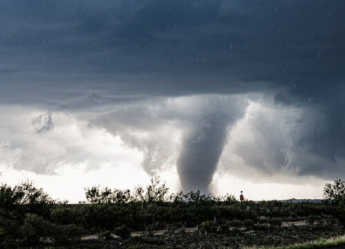 Huge dark cloud with a swirling funnel in southwest Texas