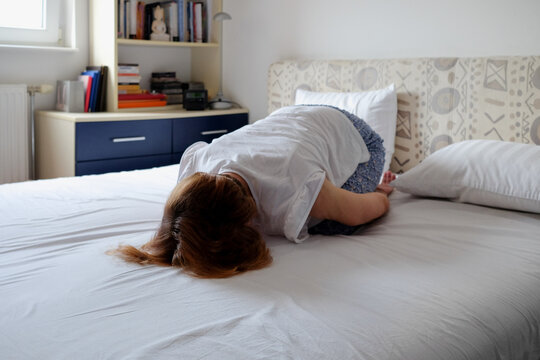Woman practicing yoga during morning time routine at home