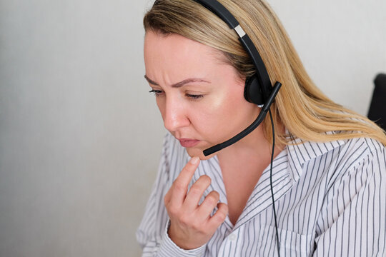Customer support worker assists client on computer 