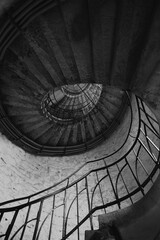Spiral stairs
abstract detailed spiral staircase in old building, abstract black wallpaper....