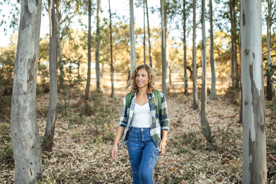 woman with backpack exploring in nature