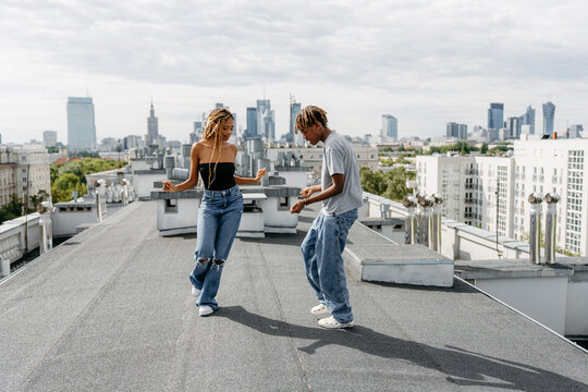 Man and woman dancing on the roof