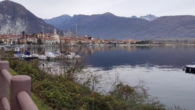 spectacular view of lakeside of Pallanza village on Maggiore Lake in Italy in silent time of sunset during winter period