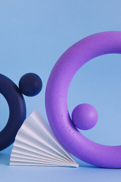 Two colored objects together on paper background