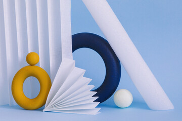 Two colored objects together on paper background