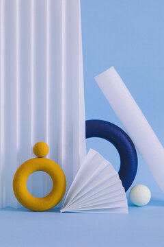 Two colored objects together on paper background