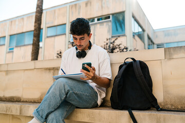 Student taking notes at school