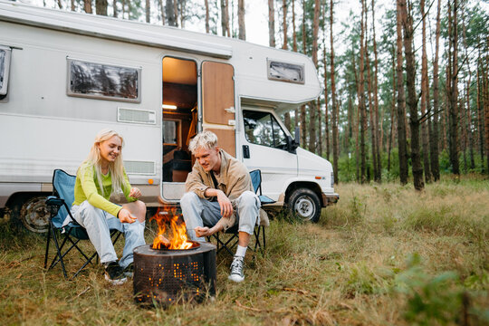 A man and a woman travel by RV
