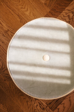 Deluxe Furniture Detail - Sunlight on Beige Pouf